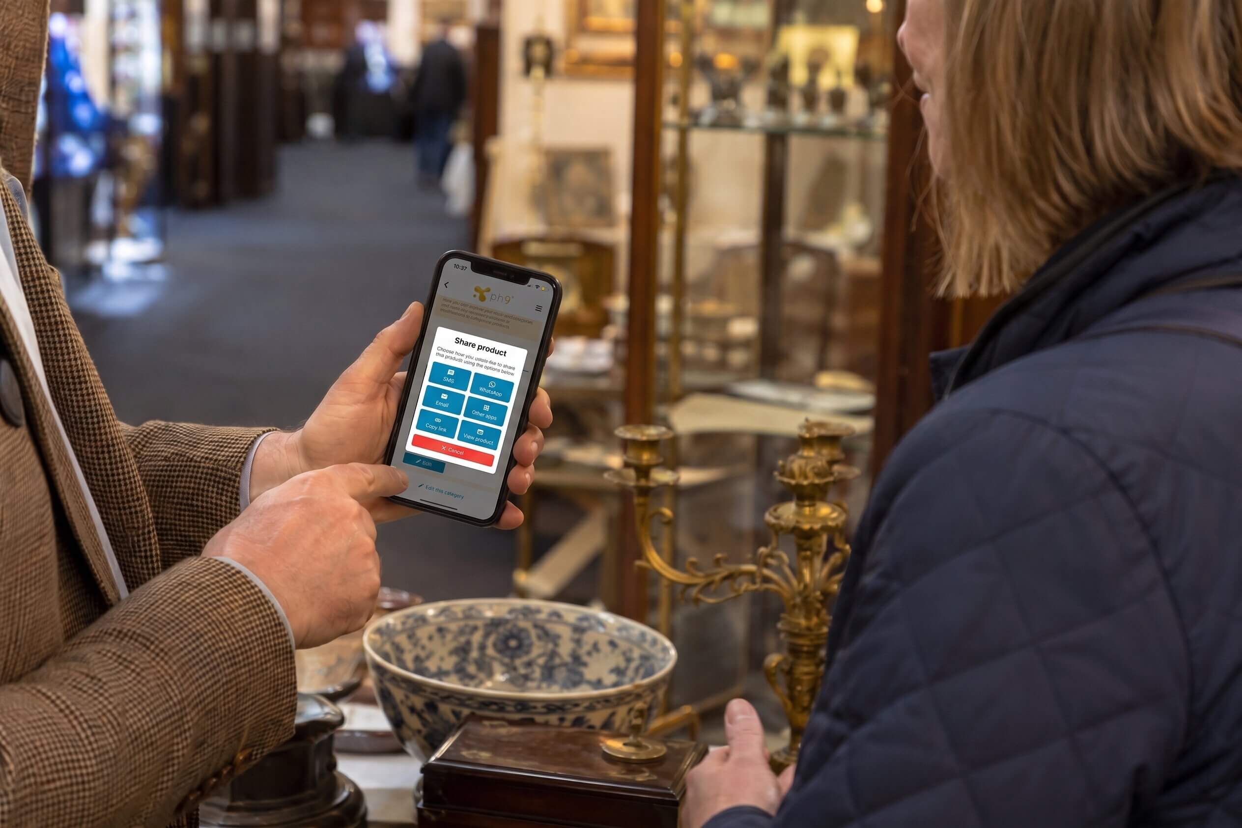 Dealer app showing stock items on mobile phone